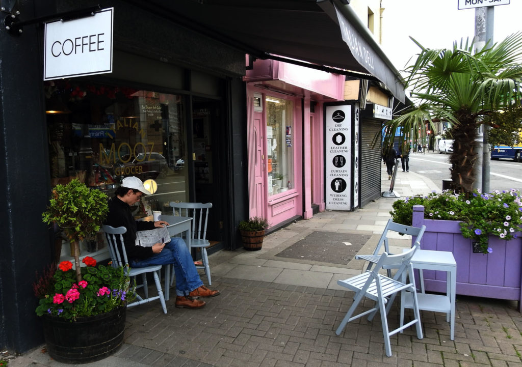 Man sitting outside cafe in Stoneybatter Dublin