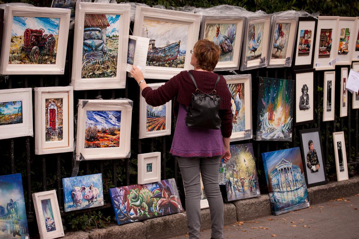Lady viewing Art Display in Merrion Square, Dublin